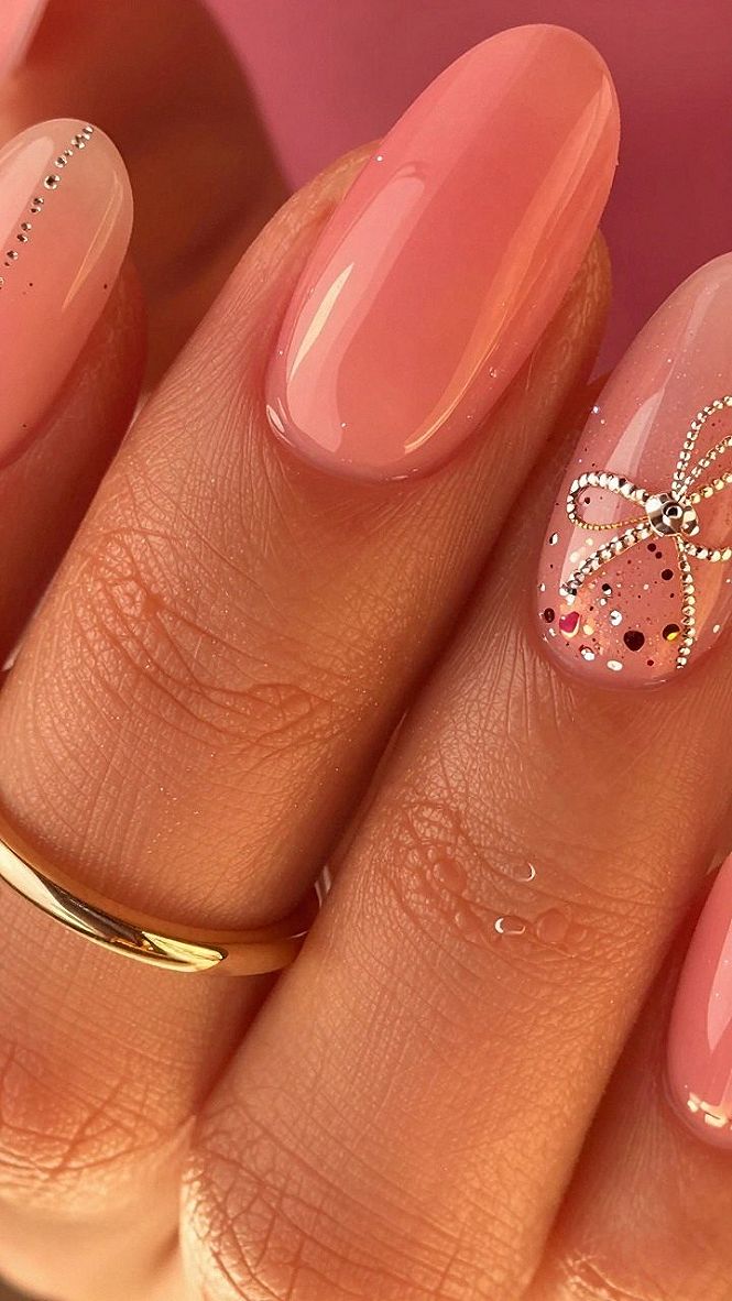 Hot Pink Nails with Dainty Bows and Sparkle Accents