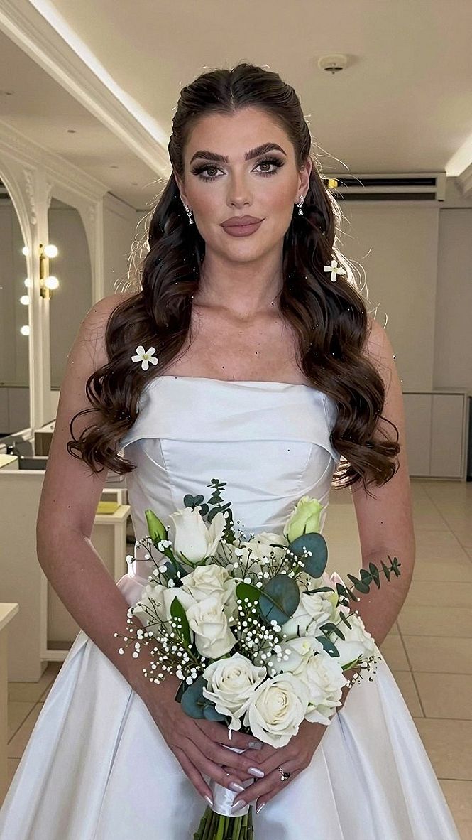 Loose Waves With Dainty Floral Pins And Statement Earrings