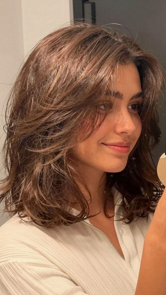 Styling Warm Brown Medium Layers with Curled Ends