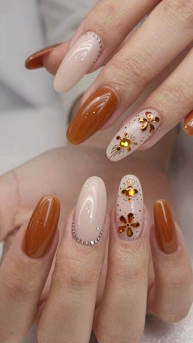 Amber Nails With Crystal Studs and Metallic Accents