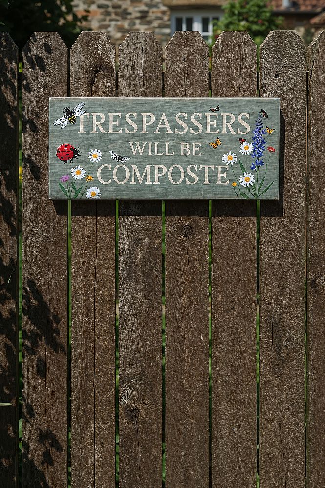 Humorous Garden Gate Decor: Rustic Signs for a Beautiful Garden