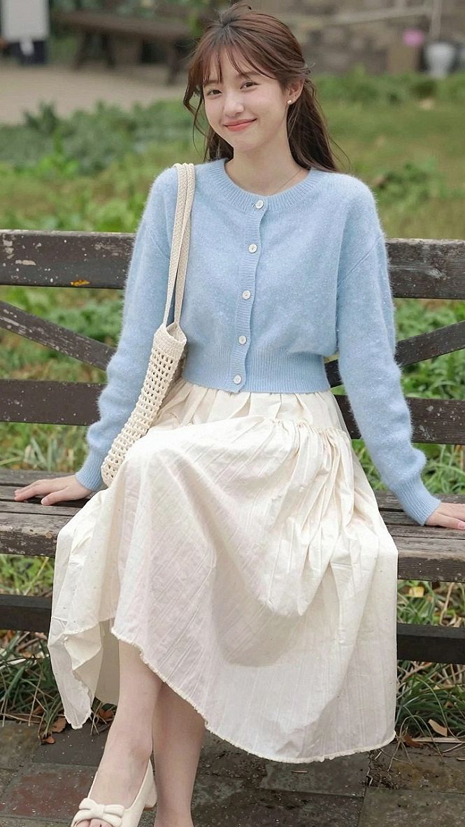 Pairing A Soft Cardigan With An Off White Pleated Skirt