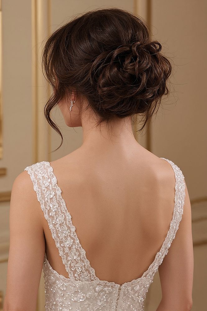 Sophisticated High Bun Wedding Hairstyle: Intricate Updo Design