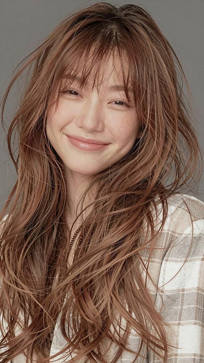 Pairing Bangs with a Strawberry Blonde Balayage