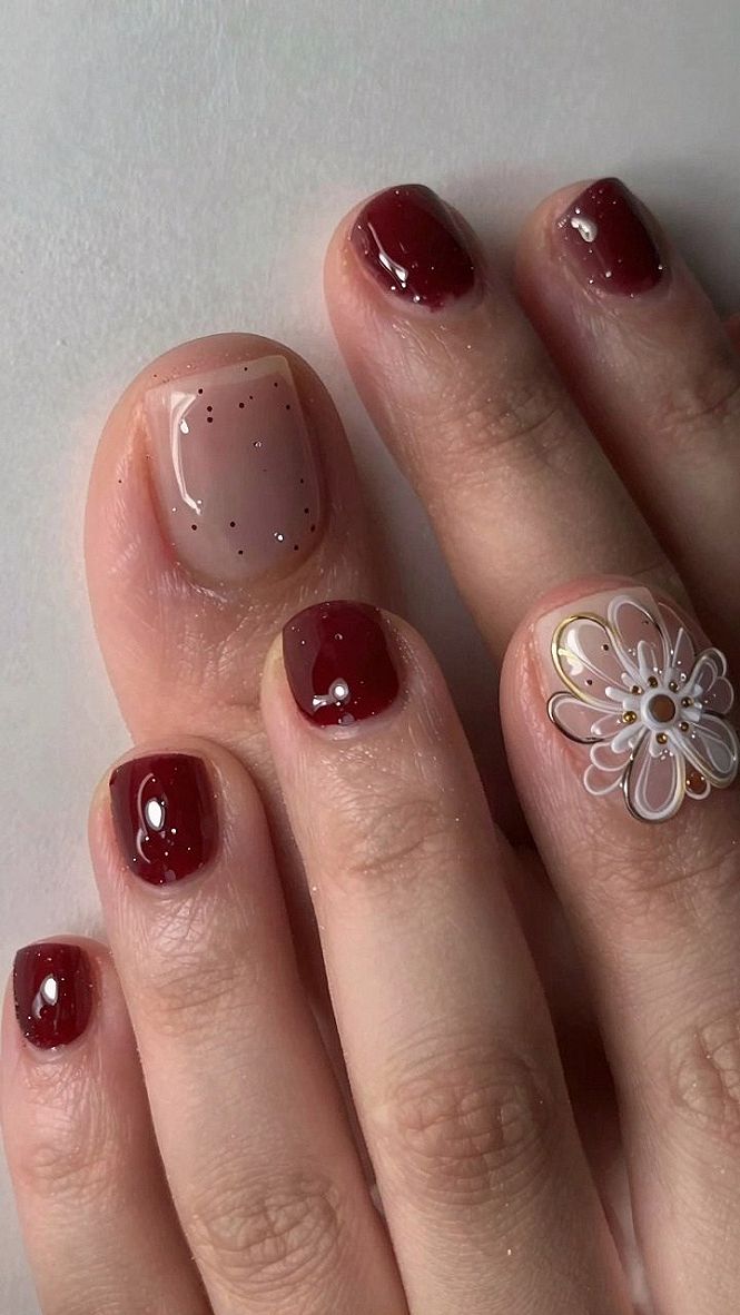 Applying Deep Red Gel Polish with Delicate Floral Accent Nails
