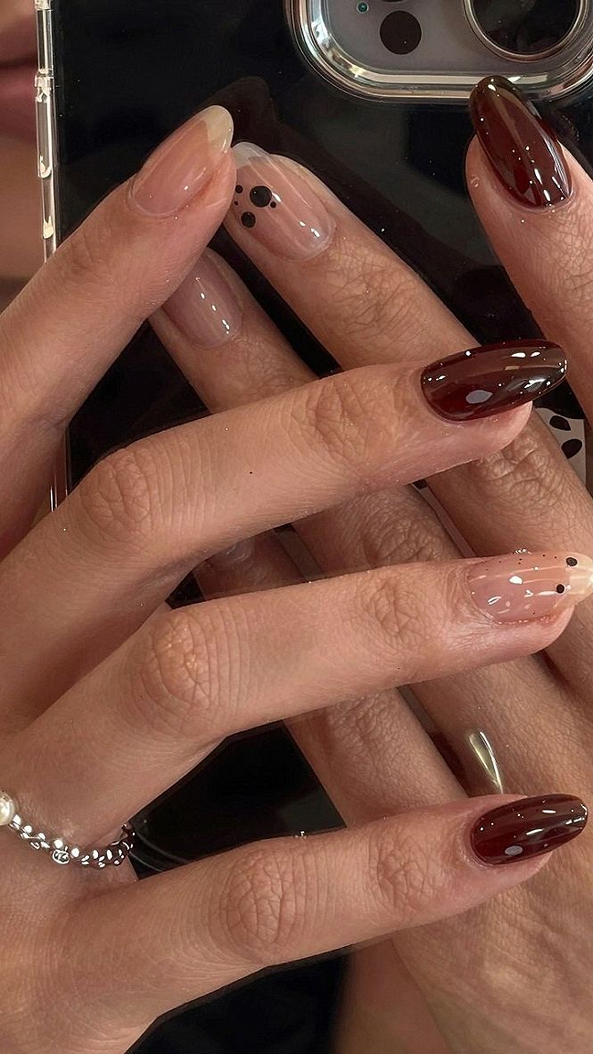 Maintaining Polka Dot and Solid Dark Almond Nails