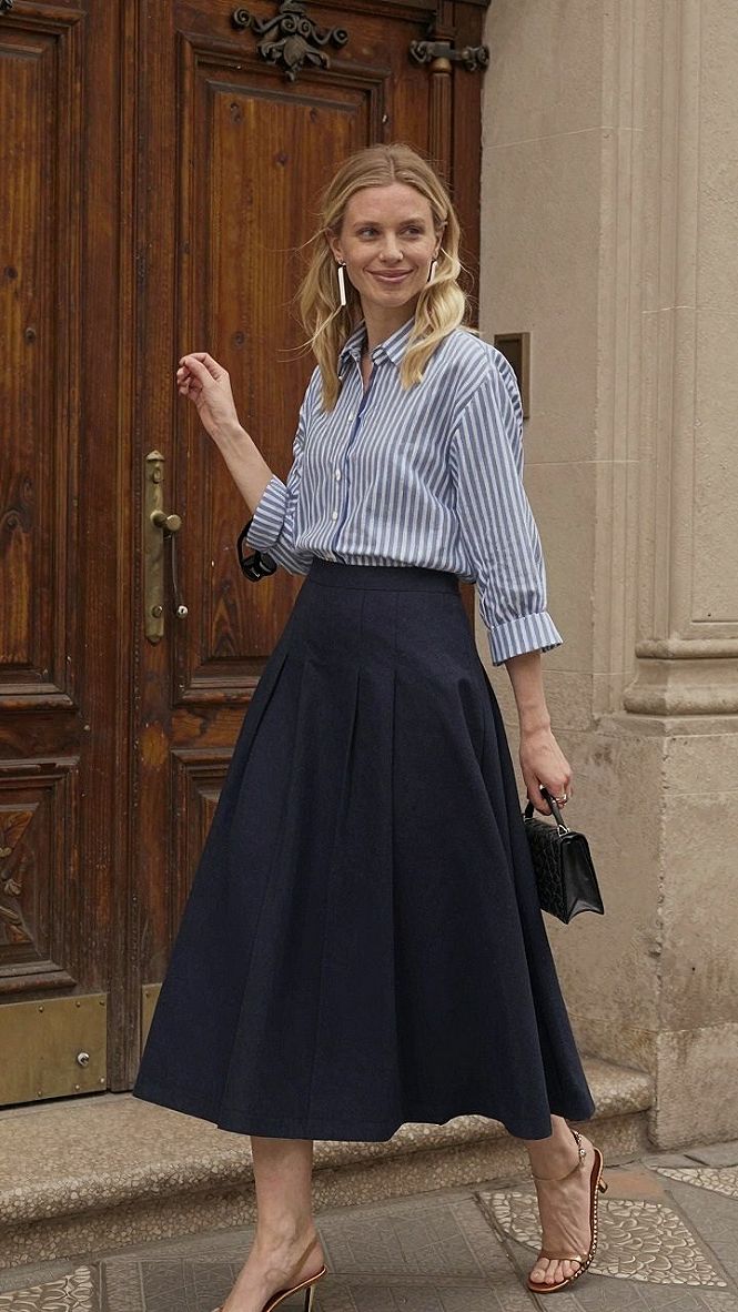 Styling A Striped Button Down With A Dark Pleated Skirt