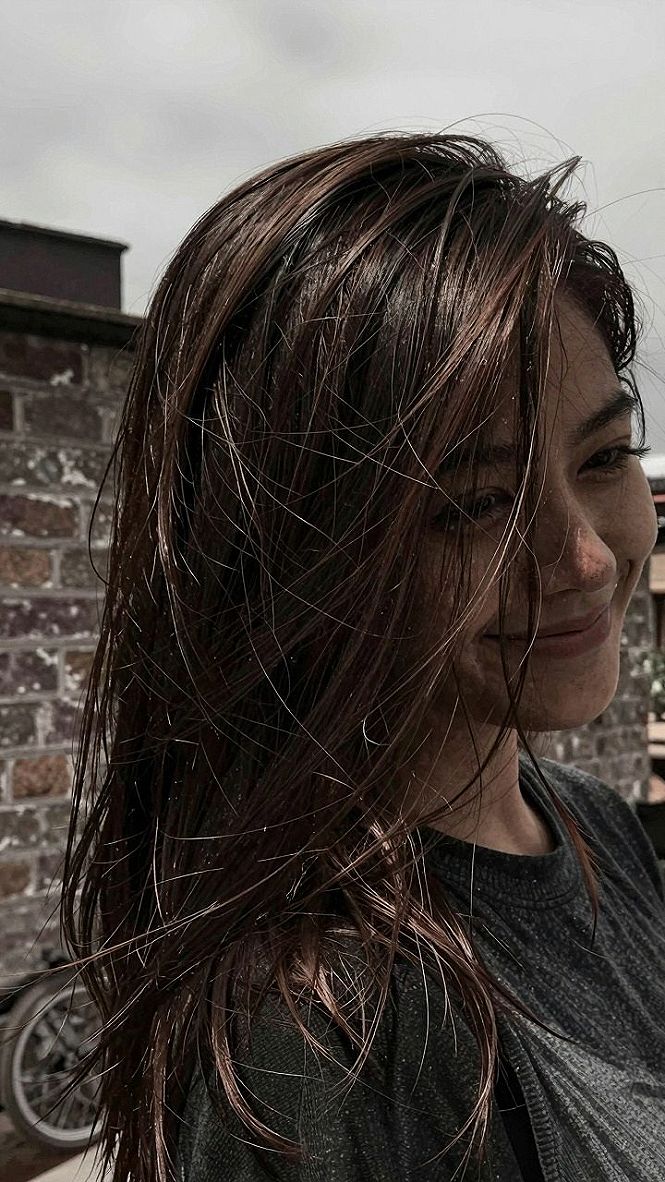 Adding Warmth With Caramel Streaks on Tousled Hair
