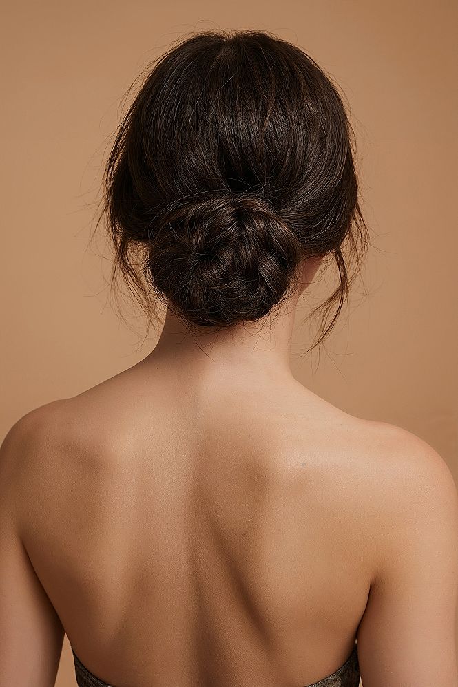 Intricate Low Bun: The Ultimate Bridal Updo for Dark Hair