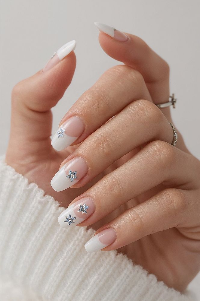Summer-Ready French Tip Almond Nails with Blue Flower Accents