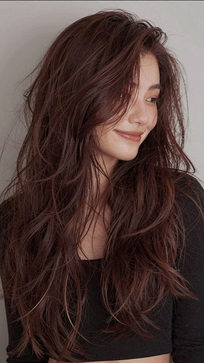 Brightening Long Auburn Layers With Subtle Winter Highlights