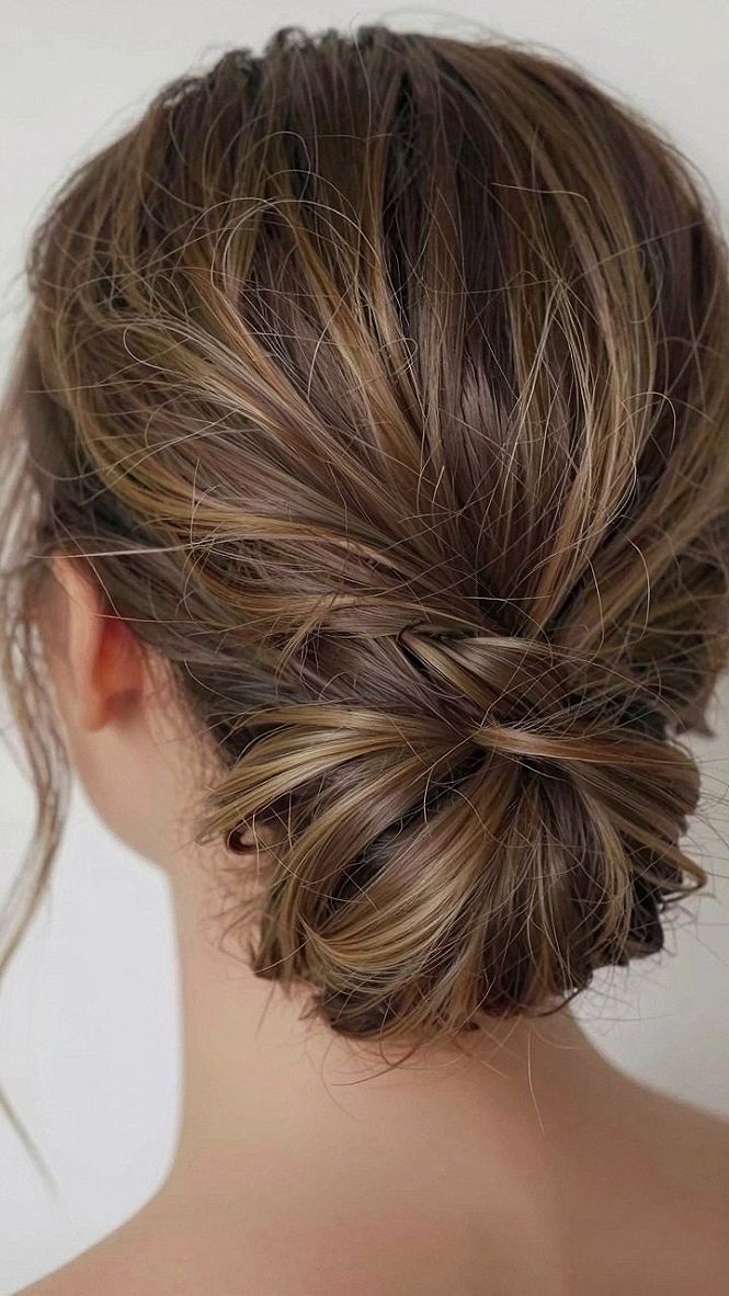 Adding Casual Charm with a Messy French Twist Low Bun