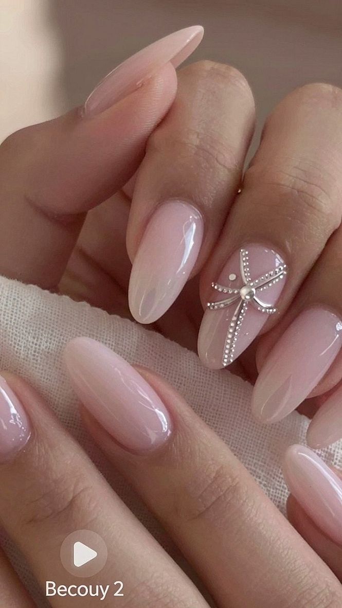 Adding Sparkle with Rhinestone Accents on Pink Nails