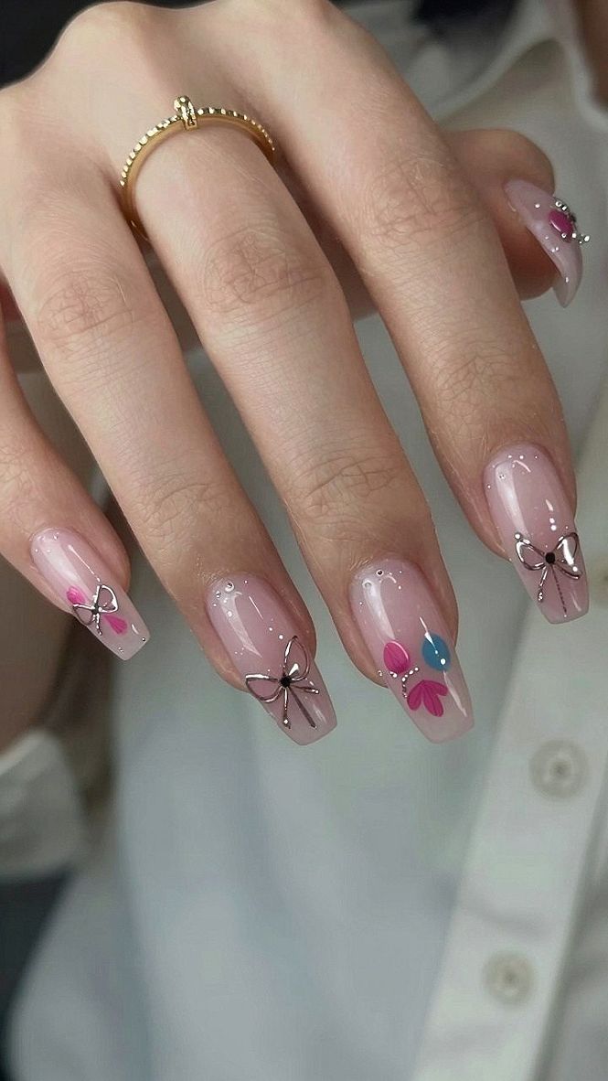 Delicate Ribbon Accents and Tiny Florals on Almond Nails