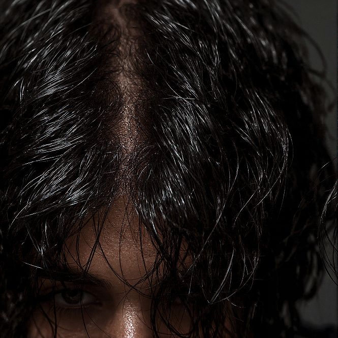 Wet Look Waves: Slicked Haircut with a Modern Middle Part
