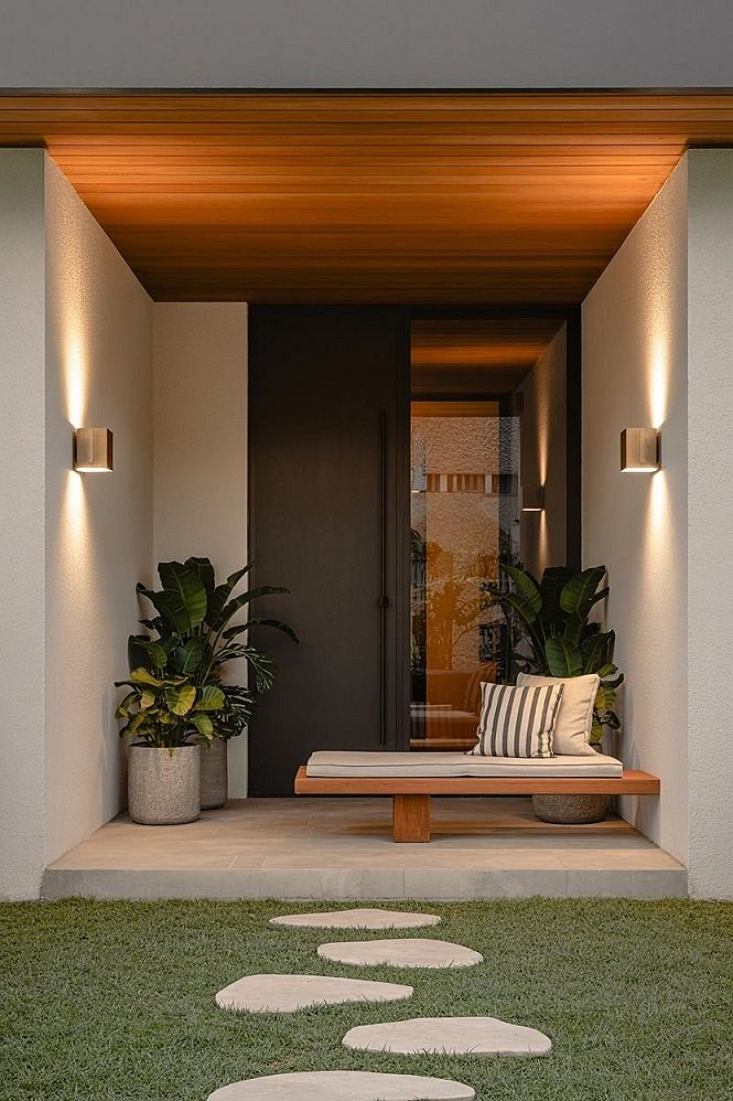 Welcoming Modern Entryway: Front Door Plants & Black Glass Door