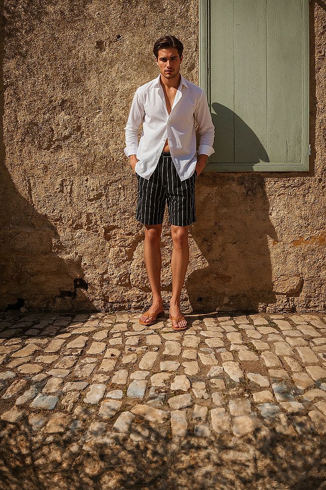 Effortless Vacation Style: White Linen & Striped Shorts for Men