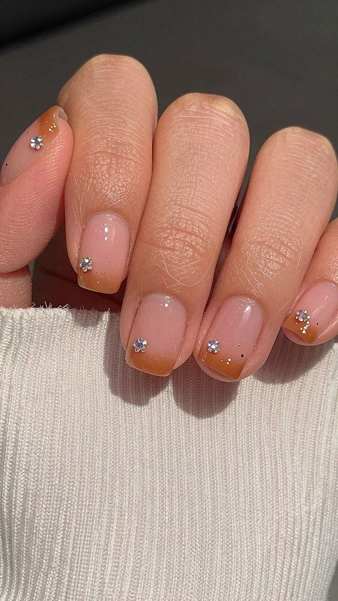 Applying Tiny Gemstones to Warm Orange Halloween Pedicures