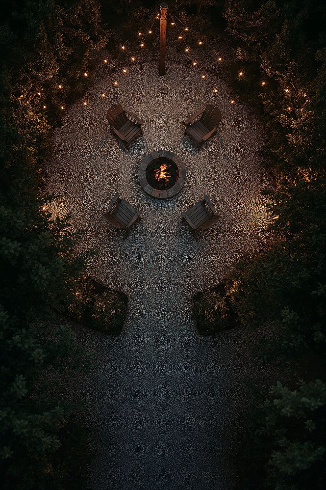 Cozy Fire Pit Area: String Lights & Gravel Backyard Retreat