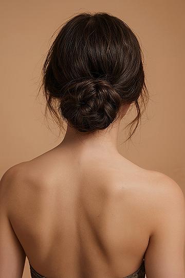 Intricate Low Bun: The Ultimate Bridal Updo for Dark Hair
