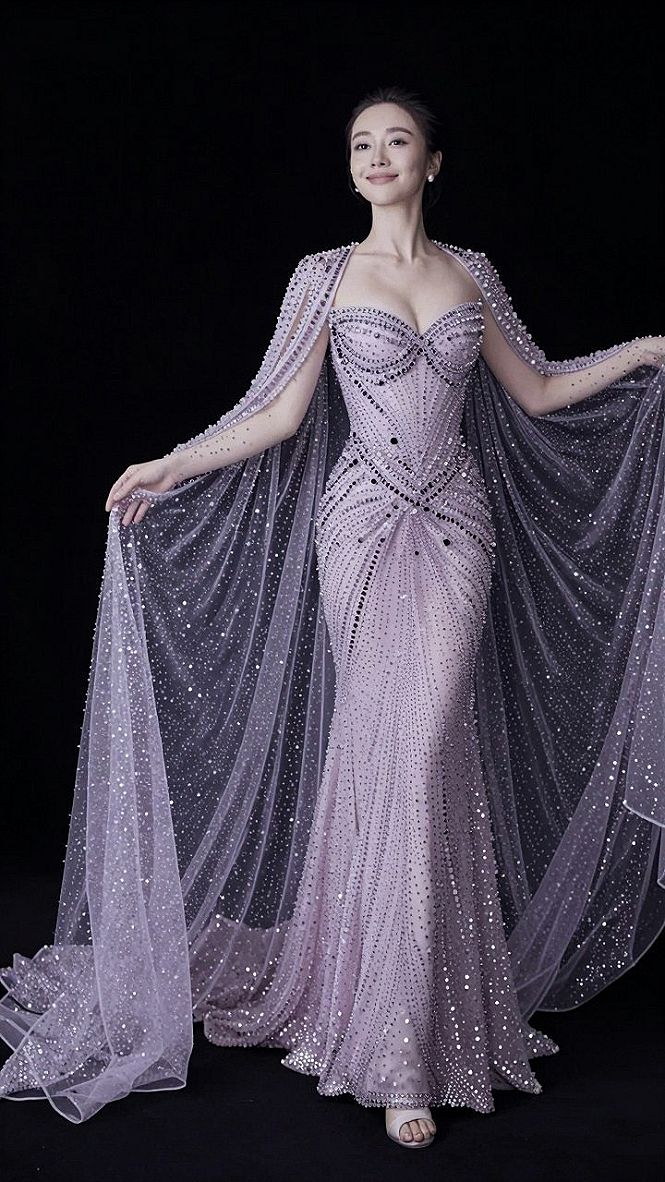 Making a Statement with Blue Gowns and Matching Capes