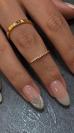 Black French Tip Almond Nails with Celestial Star Details
