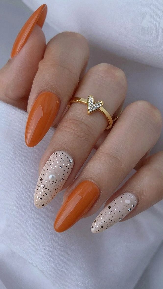 Choosing Between Solid Warm Brown And Polka Dot Beige Nail Accents