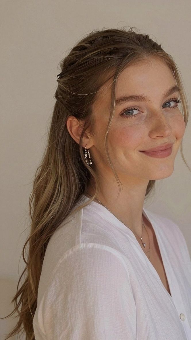 Choosing Soft Half Up Hair With Loose Tendrils And A Veil