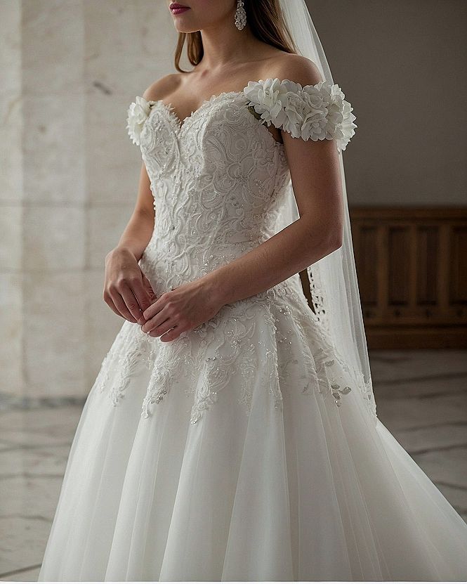 Off-the-shoulder sleeves meet intricate lace detailing