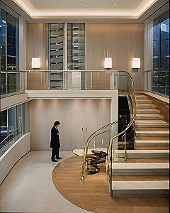 Maintaining a Curved Glass Staircase Railing in a Loft