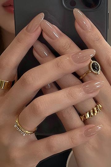 Understanding the Appeal of Glossy Nude Almond Press On Nails