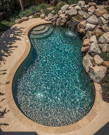 Luxury Pool Renovation: Modern Waterfall & Natural Rock Elements