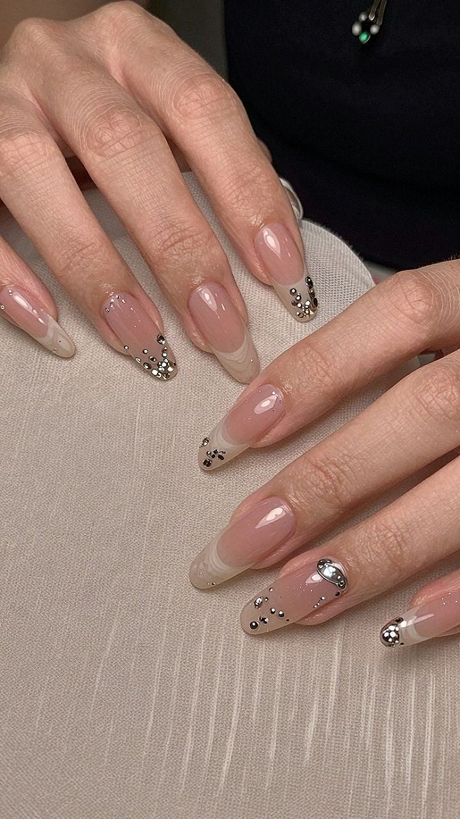 Adding Rhinestone Accents to Milky White Chrome Almond Nails