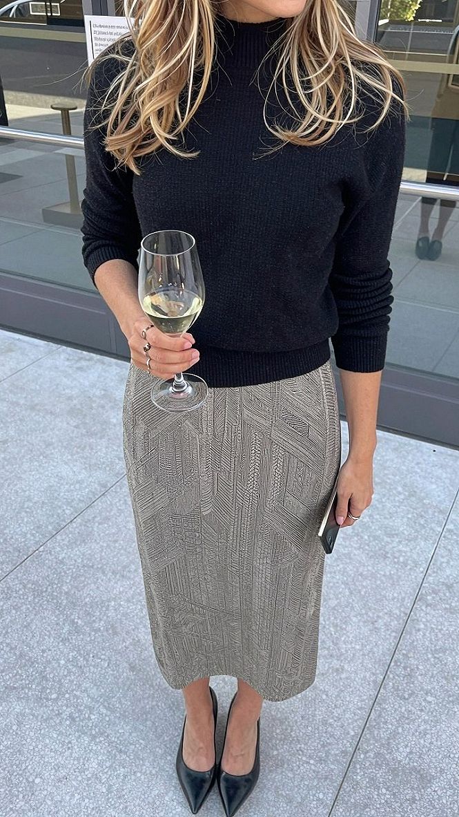 Pairing a Textured Midi Skirt with a Fitted Black Sweater