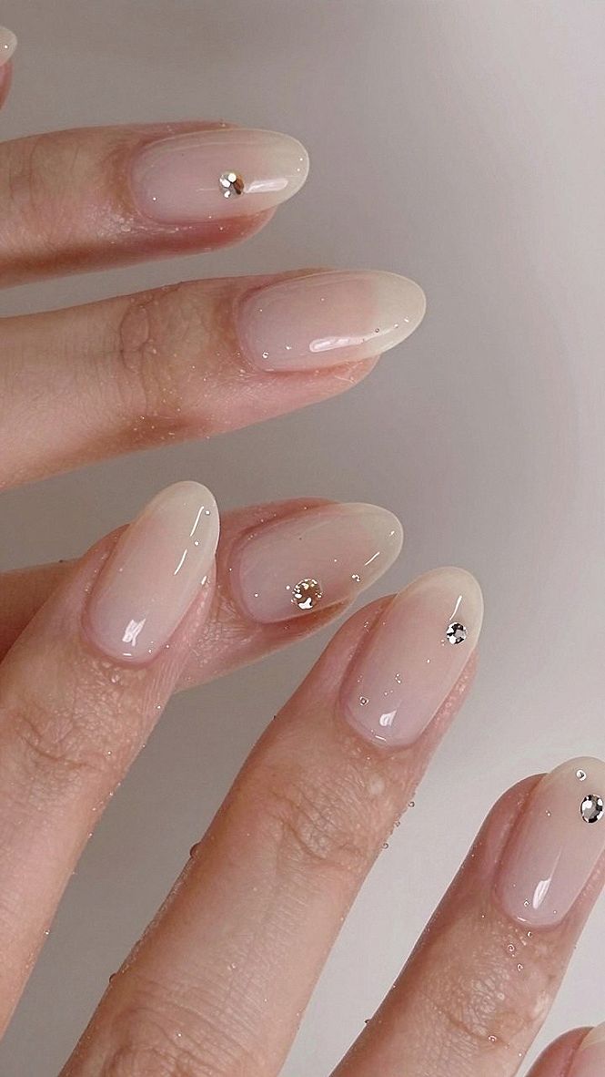 Adding Subtle Gem Accents to Milky White Chrome Almond Nails
