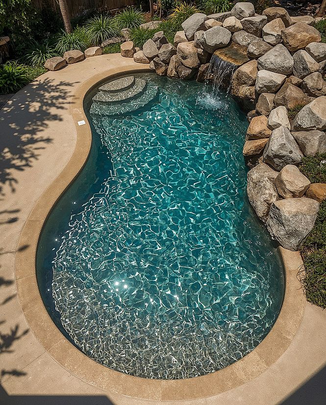 Luxury Pool Renovation: Modern Waterfall & Natural Rock Elements