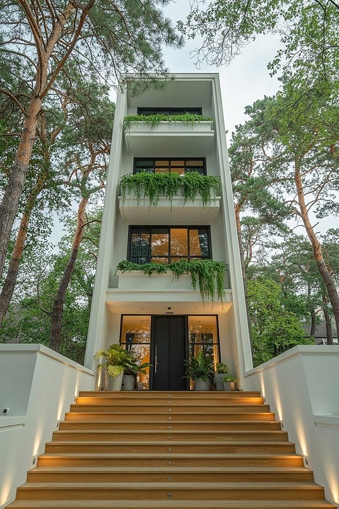 3-Story Modern Minimal Home with Lush Greenery & Glass Facades