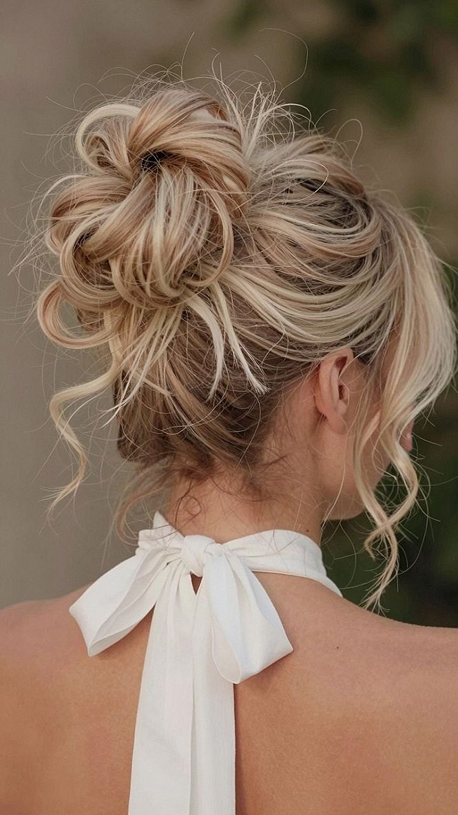 Messy Top Knot With Soft Wisps For Wedding Receptions