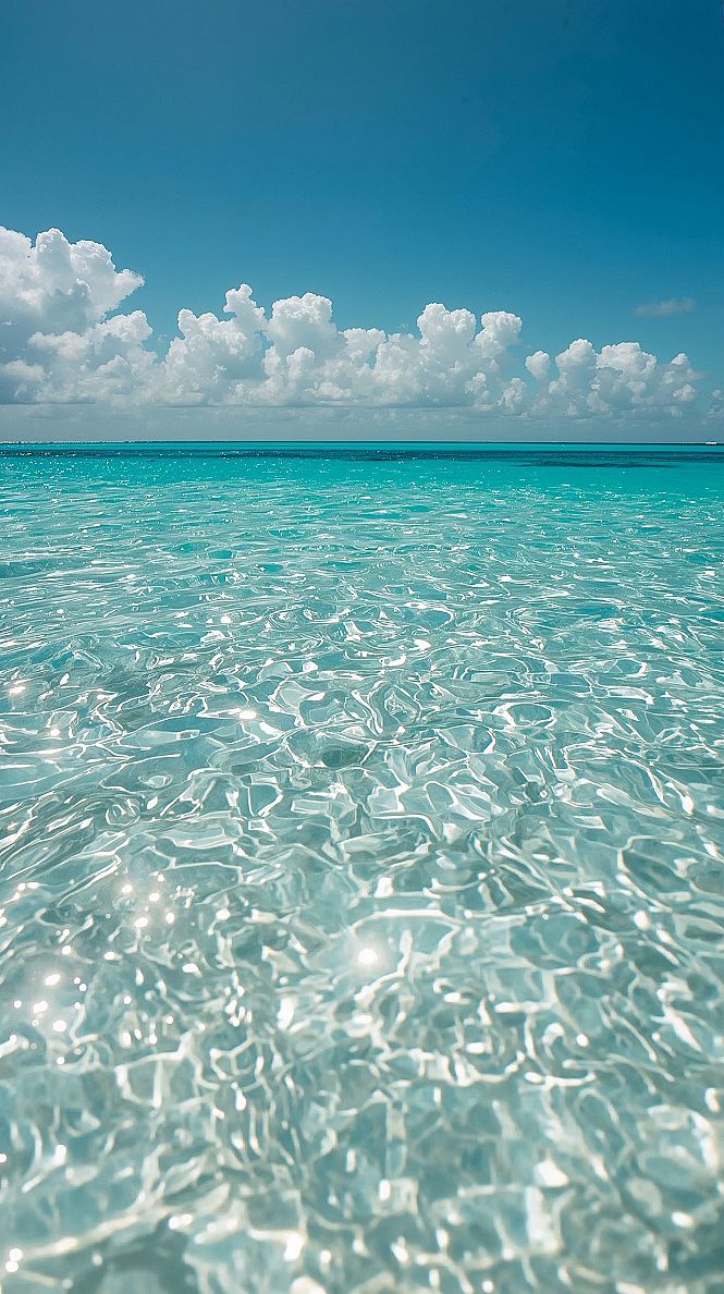 Dreamy Ocean Wallpaper: Tranquil Blue Skies & Turquoise Waters