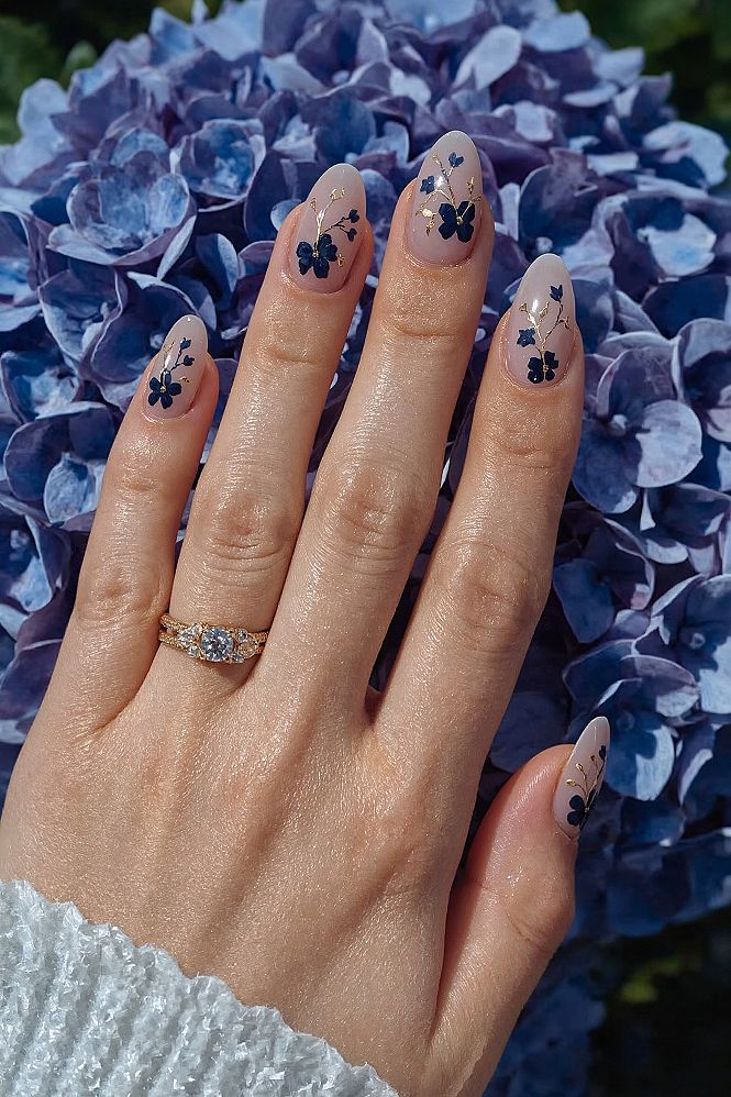 Spring Nude Almond Nails: Blue Floral & Gold Flake Trend