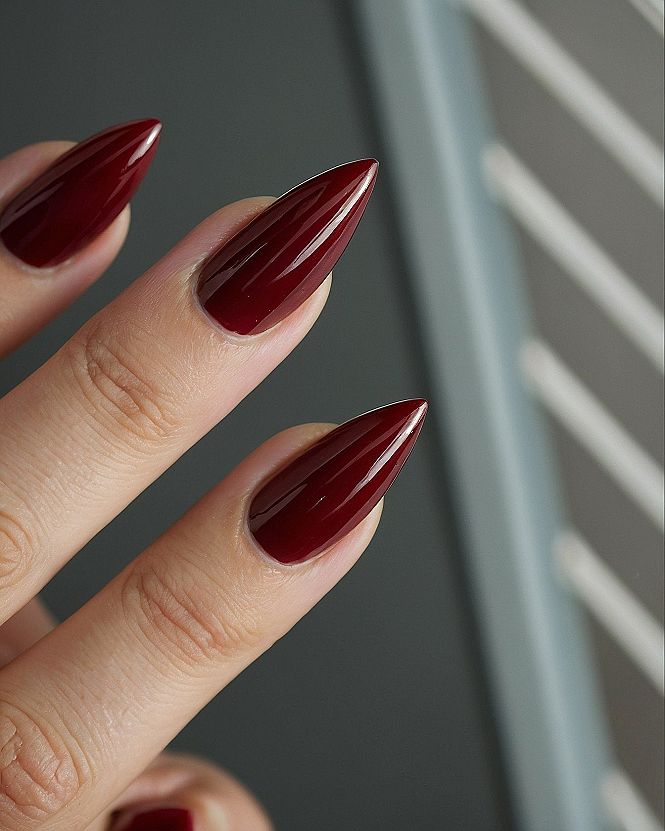Why Dark Red Stiletto Nails Work for Spooky Season