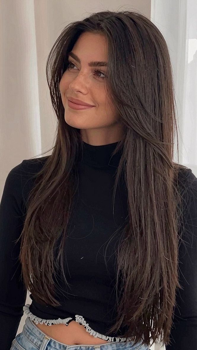 Sleek Long Haircut With Center Part and Face Framing Layers