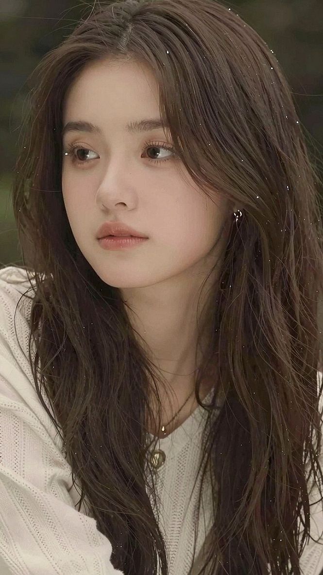 Why Medium Length Layered Hair With Sweeping Curtain Bangs Works