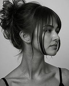 Messy Bun Updo With Wispy Front Pieces for Prom