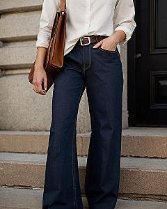 Pairing Dark Denim Jeans With A White Shirt And Leather Bag