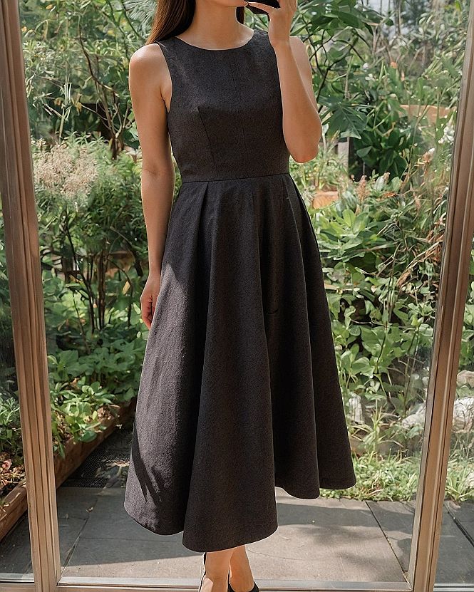 Embracing A Classic Sleeveless Black Midi Dress