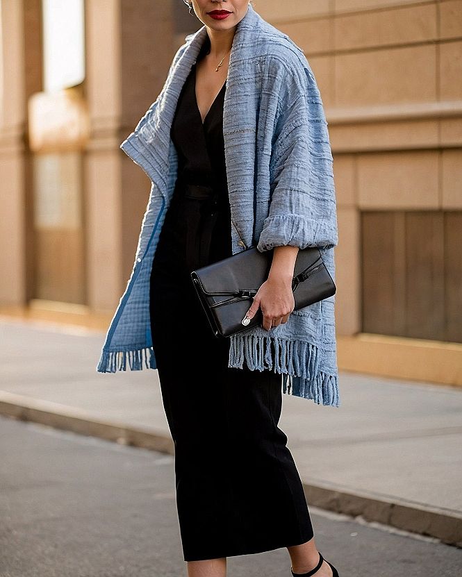 Layering a Textured Cardigan Over a Black Jumpsuit