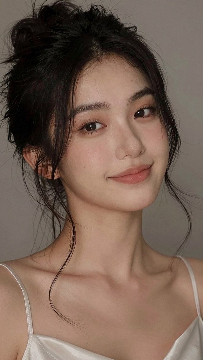 Piece-y Bangs with a Casual Updo and Soft Tendrils