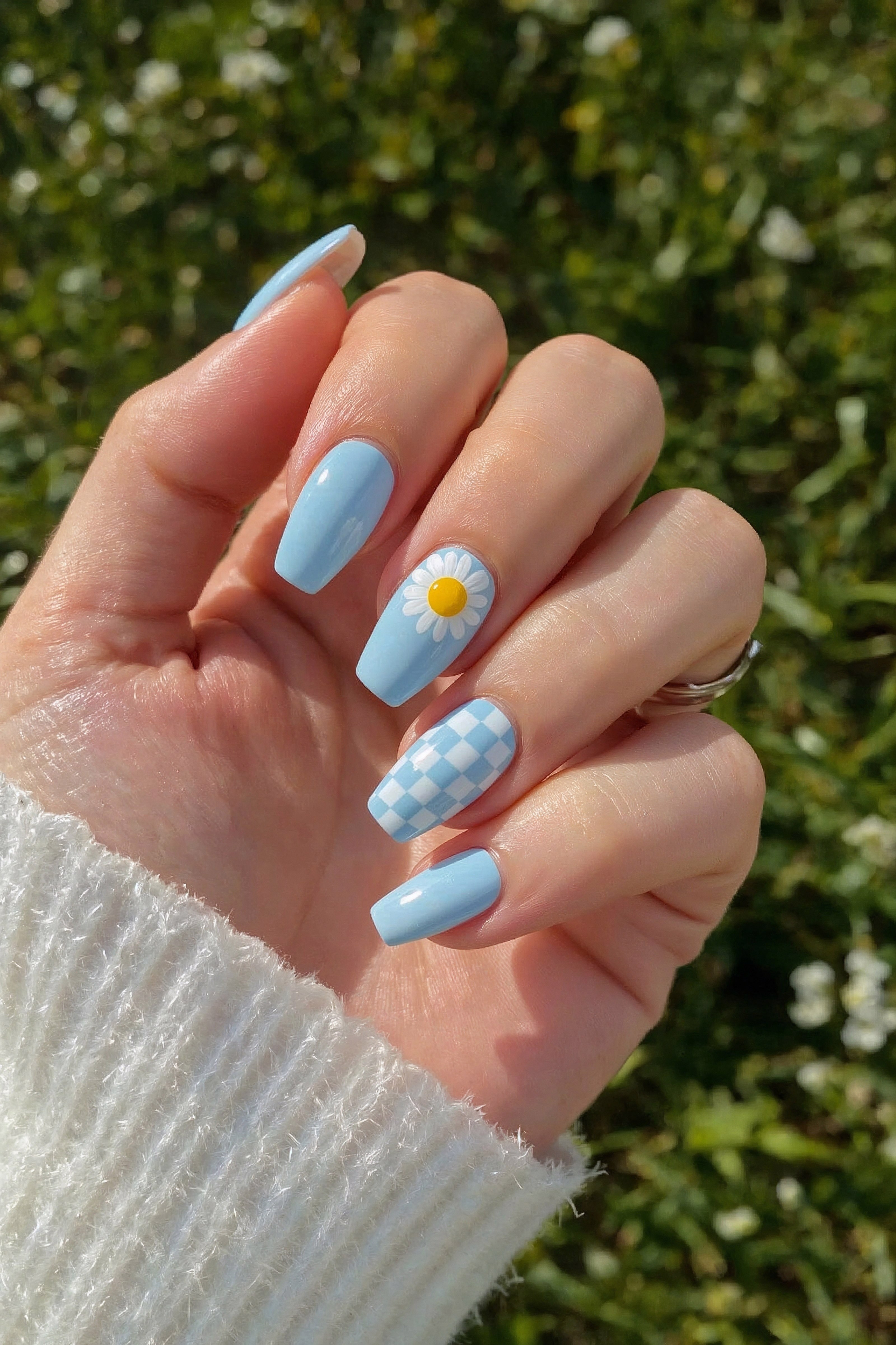 Sky blue coffin nails with daisy and checkerboard art