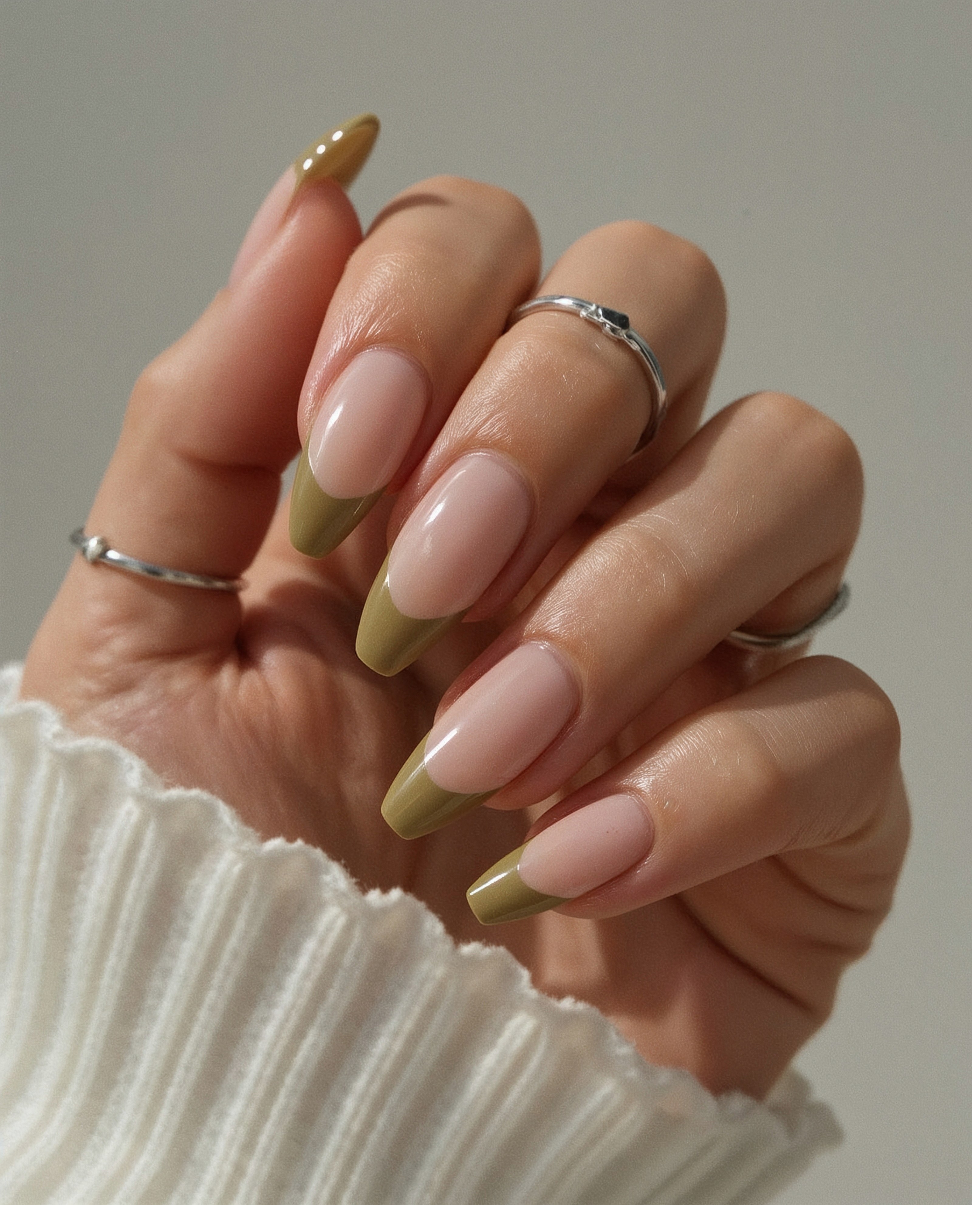 Almond nails with olive green French tips
